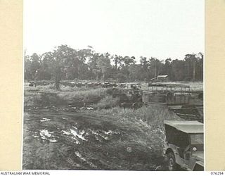 LAE, NEW GUINEA. 1944-09-27. A SECTION OF THE VEHICLE PARK OF THE 43RD FIELD ORDNANCE DEPOT