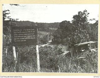 GUSIKA, NEW GUINEA. 1944-03-21. THE BATTLE SIGN MARKING THE ADVANCE ALONG THE COASTAL TRACK OF THE 29/46TH AND 22ND INFANTRY BATTALIONS, SUPPORTED BY TWO TROOPS OF MATILDA TANKS FROM THE IST TANK ..