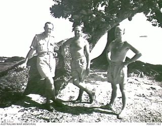 BISMARCK ARCHIPELAGO, 1945. THREE NAVAL PERSONNEL RELAXING ON EMIRAU ISLAND. (RNZAF OFFICIAL PHOTOGRAPH.)
