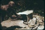 Man with shrine, pointing out skull