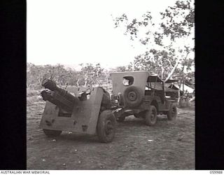 PORT MORESBY, NEW GUINEA. 1943-11-15. A "SHORT" 25-POUNDER GUN OF THE 2/5TH AUSTRALIAN FIELD REGIMENT HITCHED TO A JEEP AND READY FOR THE ROAD