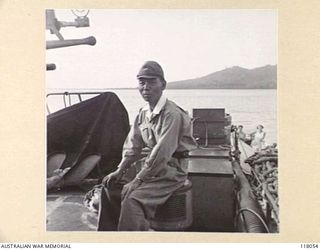 MENADO, CELEBES. 1945-09-15. MINORY YANAI, JAPANESE CIVIL ADMINISTRATOR AND OFFICER IN CHARGE OF JAPANESE COLONISATION IN THE AREA, A SUSPECTED WAR CRIMINAL, ABOARD THE RAN VESSEL HMAS GLENELG FOR ..