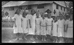 Cook Islands girls with large building in background