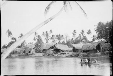 Four people in an outrigger canoe approaching a village, Ramu River, New Guinea, 1935 / Sarah Chinnery