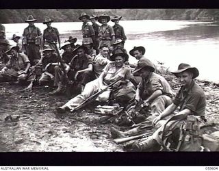 LANGEMAK AREA, NEW GUINEA. 1943-11-02. OFFICERS AND MEN OF THE 4TH AUSTRALIAN INFANTRY BRIGADE ON THE BEACH AT SIMBANG