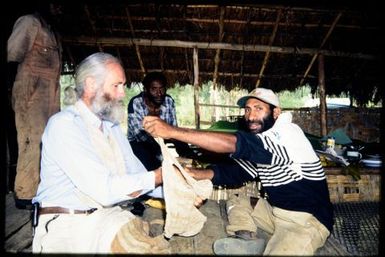 Tony Whitaker receiving gift at farewell ceremony