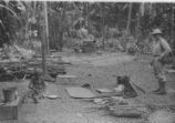 2 native women weaving mats with soldier watching; 2 native women weaving mats w/soldier watching