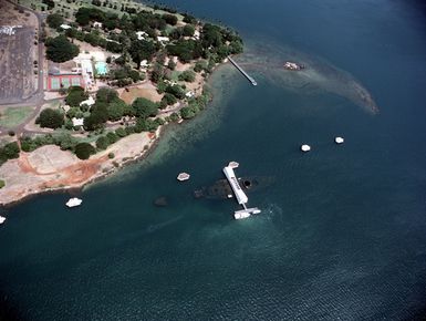 An aerial view of the USS ARIZONA MEMORIAL, center, and a portion of Ford Island
