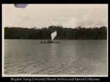 Native people on a canoe in the ocean