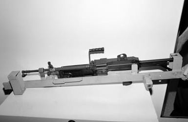 A locking storage rack aboard the amphibious assault ship USS SAIPAN (LHA 2) that has been modified to accept the M249 squad automatic weapon (SAW) (shown in rack) and the M16A2 rifle