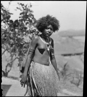 Papuan woman wearing a grass skirt, Papua, ca. 1923 / Sarah Chinnery