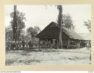 LAE, NEW GUINEA. 1944-09-28. TROOPS ENTERING THE CHURCH FOR THE DEDICATION SERVICE OF THE NEW CHAPAL AT HEADQUARTERS, NEW GUINEA FORCE