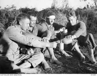 1943-08-03. THESE MEN, SOME SURVIVORS OF A CREW OF A MITCHELL BOMBER WHICH CRASHED NEAR SALAMAUA, WERE 10 1/2 HOURS IN THE WATER BEFORE THEY REACHED LAND. LEFT TO RIGHT: SGT. WALTER MALONE, OF ..