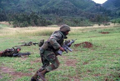 A soldier of Co. B, 4th Bn., 27th Inf. Div. (Light) makes a charge as he trains for deployment to the Middle East to take part in Operation Desert Storm. He is armed with an M-16A2 rifle