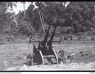 RABAUL, NEW GUINEA. 1946-07-04. JAPANESE GUN EMPLACEMENT IN THE MISSION AREA