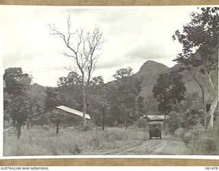 PORT MORESBY, NEW GUINEA. 1943-12-07. LOOKING DOWN THE ROAD TOWARDS THE CONTROL OFFICER OF NO. 3 SUB DEPOT, 10TH AUSTRALIAN ADVANCED ORDNANCE DEPOT. IN THE BACKGROUND CAN BE SEEN HOMBROM BLUFF