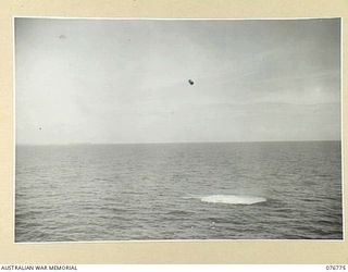 MADANG, NEW GUINEA. 1944-10-30. DEPTH CHARGES BEING DROPPED BY THE RAN SLOOP, SWAN, DURING A TRAINING EXERCISE OFF THE COAST