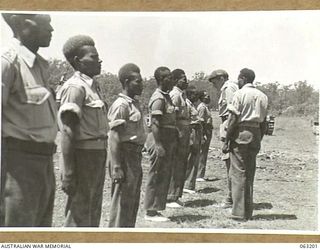 SOUTHPORT, QLD. 1944-01-18. NEW GUINEA POLICE BOYS, ON A TOUR OF AUSTRALIAN ARMY UNITS, BEING INSPECTED BY NX135 BRIGADIER D. MACARTHUR-ONSLOW, DSO., OFFICER COMMANDING 4TH ARMOURED BRIGADE