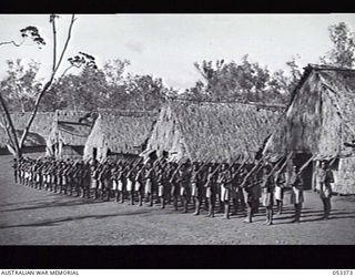 BISIATABU, SOGERI VALLEY, NEW GUINEA. 1943-07-01. "C" COMPANY, 1ST PAPUAN INFANTRY BATTALION AT RIFLE DRILL ON THE COMPANY PARADE GROUND