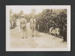 Colonel JK Murray and George Warner visiting a village, Papua New Guinea, c1948 to 1951