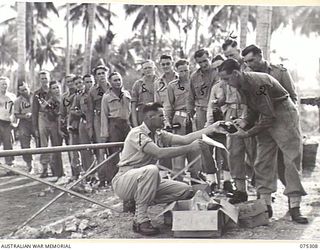 MADANG, NEW GUINEA. 1944-08-15. NX117687 WARRANT OFFICER 2 A.S. WOOLASTON, COMPANY SERGEANT MAJOR, 165TH GENERAL TRANSPORT COMPANY (1) ISSUING TROOPS WITH THEIR MONTHLY AUSTRALIAN COMFORTS FUND ..