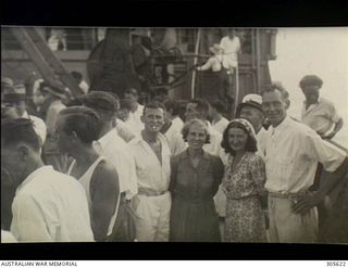 EMIRAU ISLAND. 1940-12. PASSENGERS AND CREW, AMONG THE 496 SURVIVORS WHO HAD BEEN CAST AWAY ON EMIRAU ISLAND IN THE BISMARCK ARCHIPELAGO AFTER THEIR MERCHANT SHIPS HAD BEEN SUNK BY THE GERMAN ..