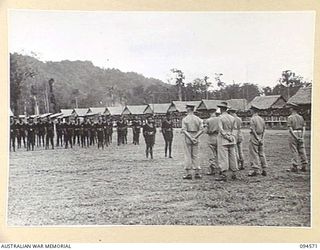 TOROKINA, BOUGAINVILLE, 1945-08-04. MEMBERS OF THE ROYAL PAPUAN CONSTABULARY ON PARADE AT THE AUSTRALIAN NEW GUINEA ADMINISTRATIVE UNIT NATIVE COMPOUND DURING THE VISIT MADE BY LIEUTENANT-GENERAL ..