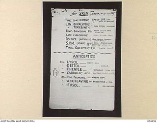 LAE AREA, NEW GUINEA, 1945-08-03. A "PIDGIN" ENGLISH CHART USED FOR THE INSTRUCTION OF NATIVE REGIMENTAL AID POST ORDERLIES. THE PHOTOGRAPH WAS MADE AT THE REQUEST OF HEADQUARTERS AUSTRALIAN NEW ..