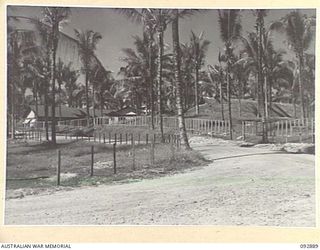 JACQUINOT BAY, NEW BRITAIN. 1945-06-09. THE VIEW FROM THE ENTRANCE OF 2/8 GENERAL HOSPITAL IN 5 BASE SUB-AREA, SHOWING WARD 1 MADE FROM NATIVE CONSTRUCTION, AND WARD 7, ROYAL AUSTRALIAN ENGINEERS ..