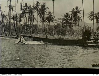 Milne Bay, Papua. 1943. Japanese invasion barges destroyed by fighter aircraft of the Royal Australian Air Force during the Japanese landing in 1942-08