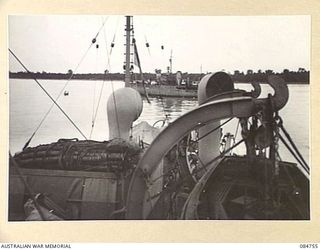 MIOS WUNDI, DUTCH NEW GUINEA. 1944-11-12. HMAS STAWELL IN THE HARBOUR ENDEAVOURING TO PULL HMAS GLENELG FROM A SANDBANK. THE SHIP WAS EVENTUALLY FLOATED OFF 12 HOURS LATER