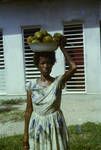 Villager from Hanuabada, making her round of govt. [government] offices with produce to sell, Port Moresby, [Papua New Guinea], 1965
