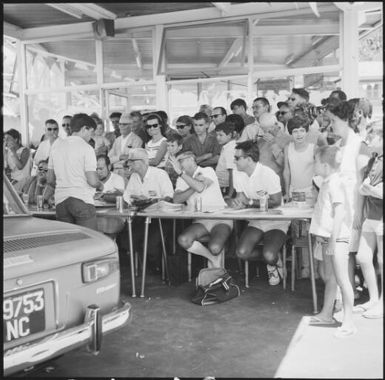 Spectators and crew gathered at the 1st Safari Calédonien racing event, New Caledonia, 1967 / Michael Terry