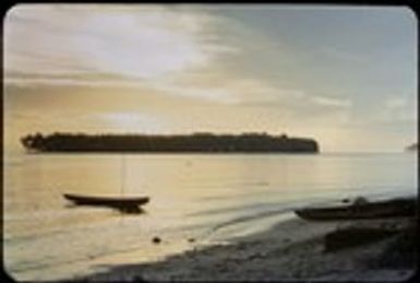 Coastal landscape with canoes