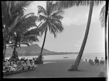 Beach chairs, with occupants, Honolulu, Hawaii