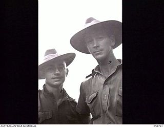 BISIATABU, NEW GUINEA. 1943-10-26. NX144207 LIEUTENANT R. D. NEWMAN (LEFT) AND WX19135 WARRANT OFFICER 2 J. B. MCCAUGHEY, BOTH OF THE 1ST PAPUAN INFANTRY BATTALION
