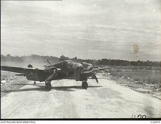 VIVIGANI, GOODENOUGH ISLAND, PAPUA. 1944-01-17. ON THE RUNWAY A BEAUFORT BOMBER AIRCRAFT OF NO. 100 (BEAUFORT) SQUADRON RAAF PREPARING TO TAKE-OFF ON A MASSED DAYLIGHT RAID ON AN ENEMY CAMP AND ..