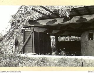 PORT MORESBY, PAPUA, NEW GUINEA. 1944-03-27. THE NO.2 GUN EMPLACEMENT HOUSING A 6 INCH GUN AT PAGA BATTERY, COAST ARTILLERY, AT THE MOUTH OF THE HARBOUR