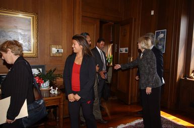 Secretary Gale Norton greeting members of visiting political delegation from American Samoa, at Department of Interior headquarters