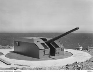 PORT MORESBY, PAPUA. 1944-08-17. NO. 2 GUN (5.25) OF THE BASILISK BATTERY, 801ST ANTI-AIRCRAFT AND COAST ARTILLERY BATTERY COMPLETED AND READY FOR ACTION WITH THE EXCEPTION OF CLOSING THE RIGHT AND ..