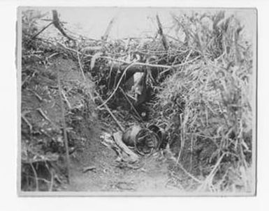 [Helmets Discarded in Trench]