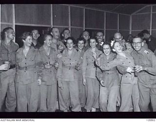 RABAUL, NEW BRITAIN. 1945-12-28. THE PRIME MINISTER OF AUSTRALIA, MR BEN CHIFLEY, ARRIVED BY PLANE TO VISIT MANY OF THE UNITS IN THE AREA. GUESTS AT THE BAR IN THE SISTERS' MESS AT 118TH AUSTRALIAN ..