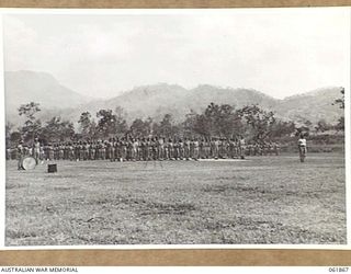 17 MILE, PORT MORESBY AREA, 1943-12-24. TROOPS OF THE 10TH AUSTRALIAN ADVANCED ORDNANCE DEPOT ON PARADE FOR AN INSPECTION BY VX247 BRIGADIER C. A. STINSON, DEPUTY DIRECTOR OF ORDNANCE SERVICES, ..