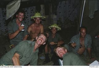 Off duty at Pangi Village. Back row left to right : Sappers John Tapai, Ted Cherry, Mick Hadley, 'Hoppy' Hopper; Front row left to right Lieutenant Graeme Membrey and Corporal Steve Thomas. This ..