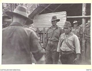 RABAUL, NEW BRITAIN. 1945-11-15. AN IDENTIFICATION PARADE OF SUSPECTED JAPANESE WAR CRIMINALS WAS ARRANGED BY THE WAR CRIMES COMMISSION, AT HEADQUARTERS 11 DIVISION. SHOWN, A JAPANESE SOLDIER AND ..