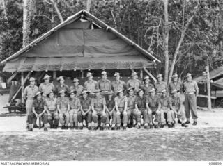 FAURO ISLAND, BOUGAINVILLE AREA. 1945-11-13. MEMBERS OF 9 PLATOON, A COMPANY, 7 INFANTRY BATTALION. FRONT ROW LEFT TO RIGHT, 1. DEVERE, D. 2. KERR, S. 3.DONAGHY, T. 5. HAINES, L. 6. LT PIMM. 7. ..