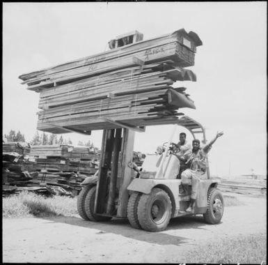 Two Pacific Lumber Company employees sitting on a fork lift, Fiji, November 1969 / Michael Terry