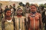 Adolescent girls with face and body paint, pearlshell pendants and other finery, ready for their dance