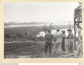 WEWAK AREA, NEW GUINEA, 1945-06-14. MAJ J.D. MURRAY, BRIGADE MAJOR (2), INDICATES TO GENERAL SIR THOMAS A. BLAMEY, COMMANDER-IN-CHIEF, ALLIED LAND FORCES, SOUTH WEST PACIFIC AREA (1). AREAS WHERE ..