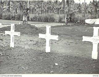 MILNE BAY, NEW GUINEA, 1944-02-09. THE GRAVES OF 408253 FLIGHT SERGEANT DONALD KEVAN COOPER AND 415619 FLIGHT SERGEANT FREDERICK KEITH CORNISH, BOTH OF NO. 100 SQUADRON RAAF, WHO WERE KILLED ON ..